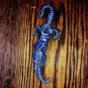 Dragon dagger. As long as my fore arm. Sharp. Almost new.